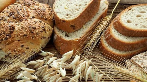 Assortment of baked goods on old wooden table. Freshly of bakery products.