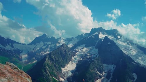 Snowy Mountain Against Cloudy Sky