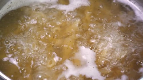 Pasta Boils Vigorously in Pot of Water