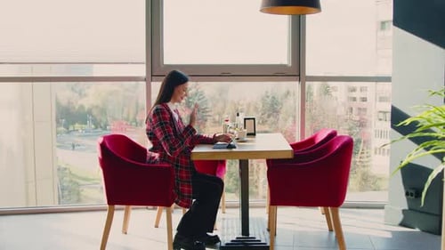 Woman Has Video Call In Cafe