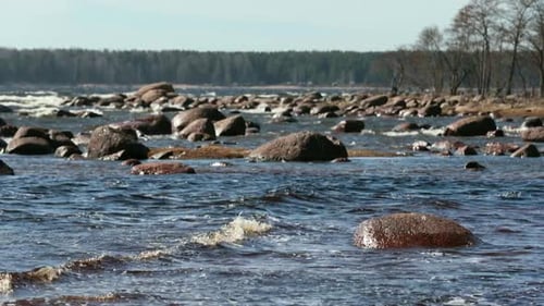Rocky shore with waves of the sea.