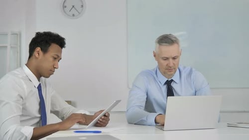Two Men Working in Bright Modern Office