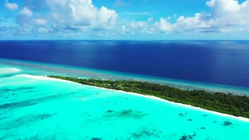 Aerial texture of idyllic coastline beach trip by blue ocean with white sand background of a dayout