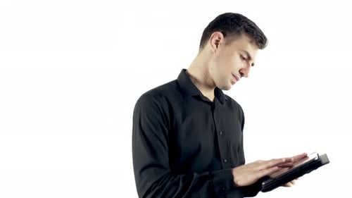 Young Adult Using Tablet in Studio Setting