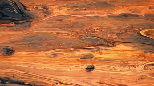 Abstract Paint Swirling in Shades of Orange and Black