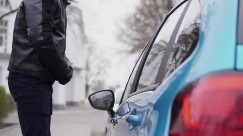 Man Attempting to Break Into a Car