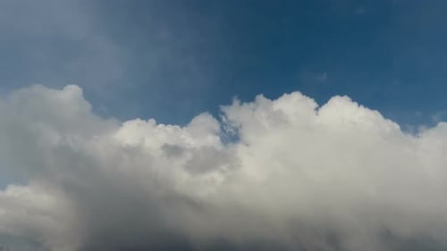Clouds Passing in Blue Sky