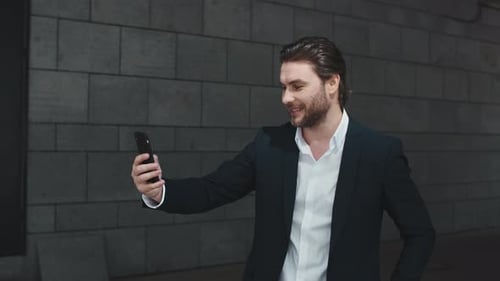Business Man Waving Hand at Camera on Street. Entrepreneur Talking on Video Chat