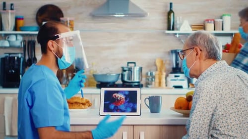 Healthcare Worker Explains Virus Details to Elderly Man