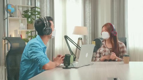 Wearing Protect Mask, Asian Man Host Record Podcast Interview woman Guest Conversation For Content