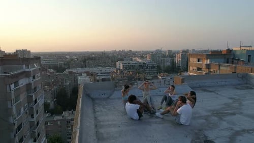 Group of Happy Fit Friends Exercising Outdoor in City