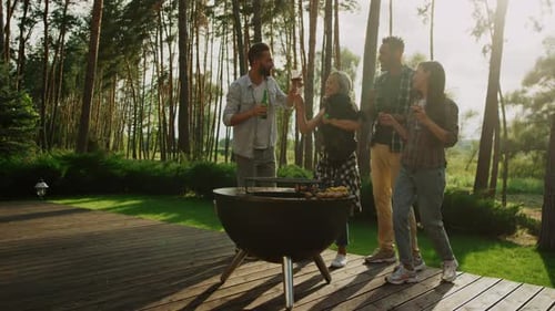 Friends Gather by Grill on Summer Afternoon