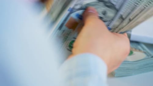 Close Up of Counting Money Stacks