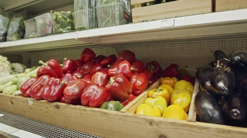 Large variety of vegetables and fruits on a supermarket shelves
