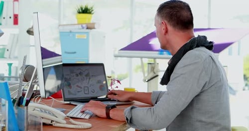 Adult Man Working at His Desk in Office