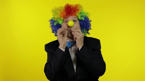 Person in Clown Costume Making Funny Faces