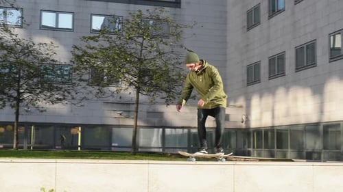 Young Adult Skateboarding Trick in Urban Setting