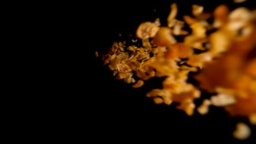 Potato Chips Fall With White Liquid on Black
