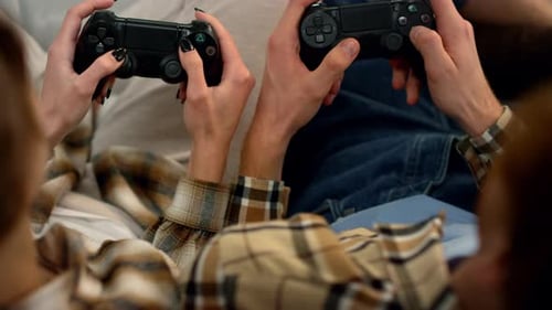 Young Adults Playing Video Games at Home