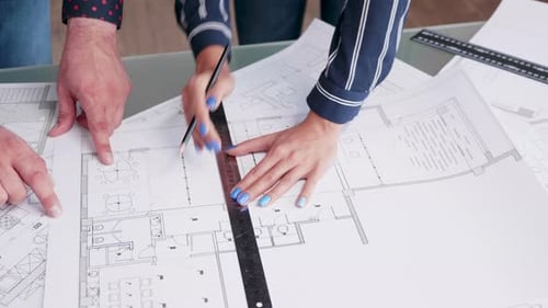 Close Up of Architects Making Changes To a House Project