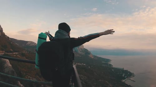 Female Hiker Admiring Mountain Ocean View at Sunset