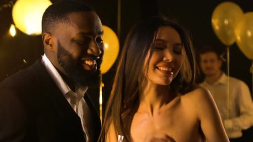 Couple Dancing at Joyful Confetti Party Celebration