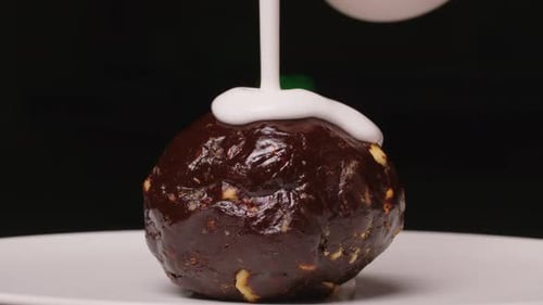 Chocolate Dessert Ball Covered in White Icing
