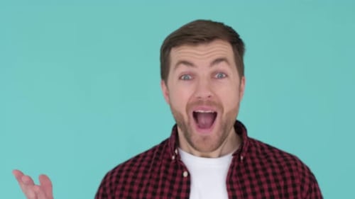 Man Reacts with Shock and Surprise