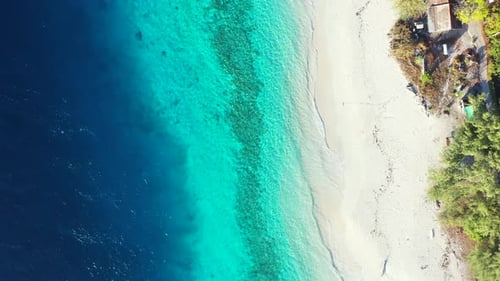 Luxury flying copy space shot of a white sandy paradise beach and blue ocean background in colorful