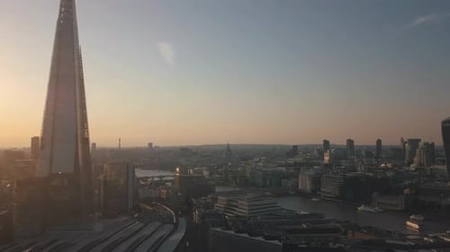 The Shard in London next to Thames River with Skyscraper Skyline View at Sunset or Sunrise, Aerial D