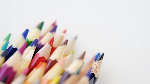 Assorted Colored Pencils Arranged on White Background
