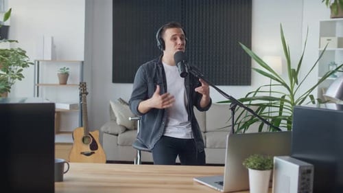 Young Man Reads Rap While Recording at Home Music Studio
