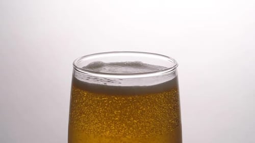 Close Up of Golden Beer with Bubbles