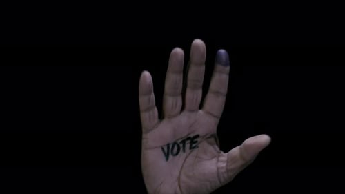 Hand with Vote Written on Palm and Ink Stained