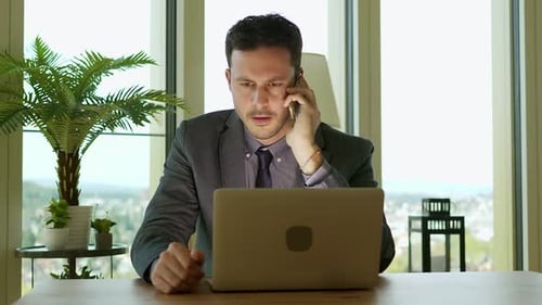 Young Handsome Man Working on Computer Desk in Modern Office