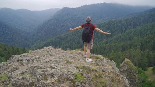 Lone Hiker Walking Mountain Cliff Spreads Arms