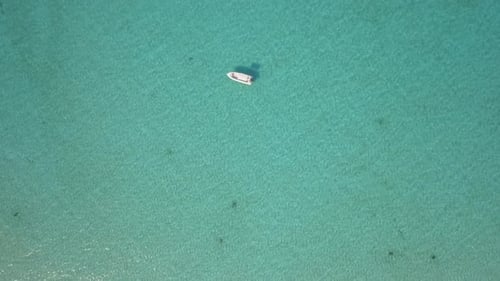 Aerial drone view of a fishing motor boat in the Bahamas, Caribbean