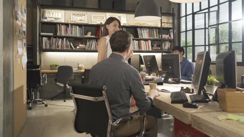 People Working in Modern Open Office Environment