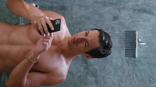 Man Using Phone in Shower