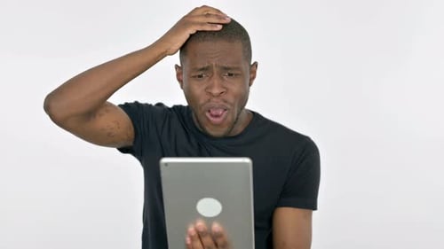 Man Confused by Tablet, Hand to Head