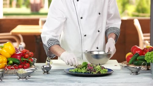 Chef Prepares Gourmet Salad in Restaurant Kitchen