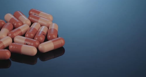 Capsule Pills on a Reflective Surface