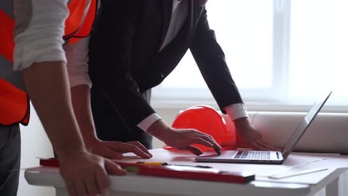 Close Up of Male Contactor and Entrepreneur Using Laptop