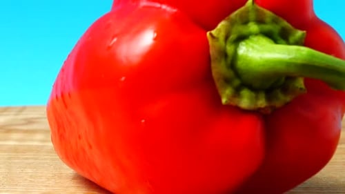 Red Bell Pepper on Wooden Surface, Close Up