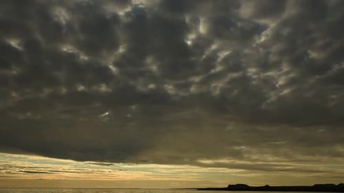 Golden Hour at the Sea with Overcast Skies