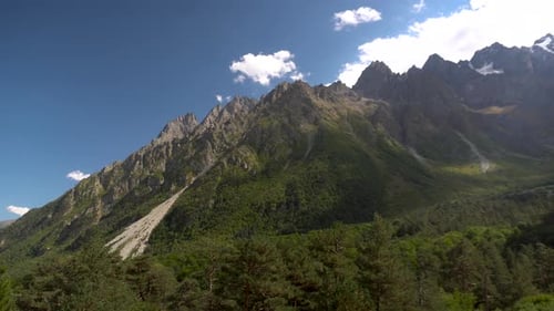 View of the Rocky High Mountains. Panorama From Right To Left.