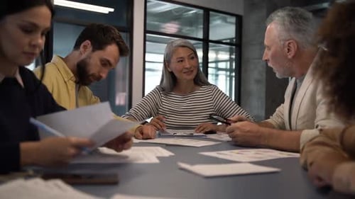 Business Team Collaborates in Bright Modern Workplace