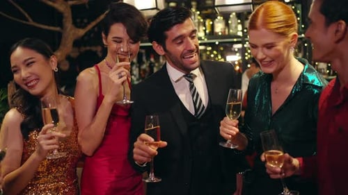 4K Group of people celebrating holiday event with toasting champagne glasses together at luxury bar