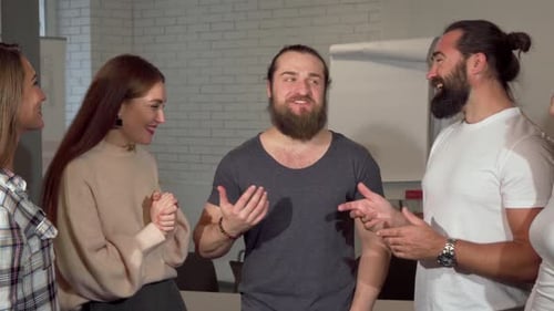 Group High Fives in Celebration at the Office