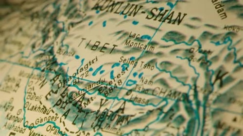 The camera glides over Mt Everest, Tibet, Delhi, Kashmir, Lahore, Pakistan